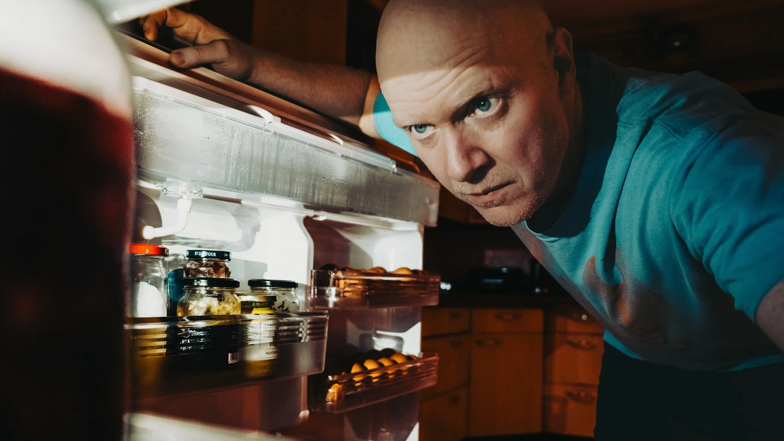 "Fridge Raider" from "The Procrastinator" series. 2025.
Using torch light from phone to simulate fridge light.