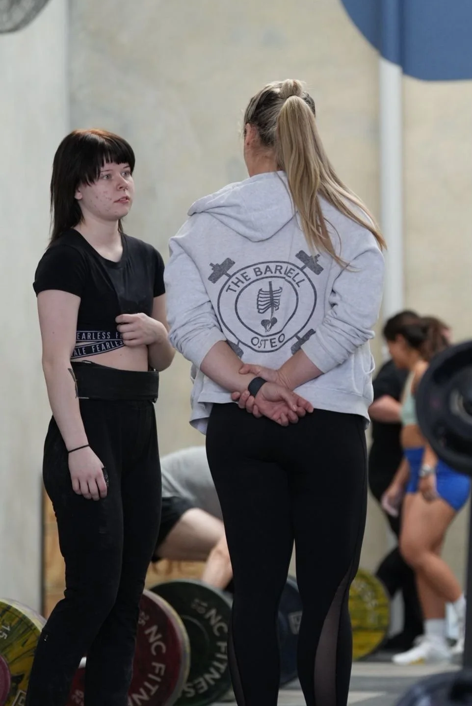 Dr caity haniver coaching on the gym floor at her gym melbourne west barbell club