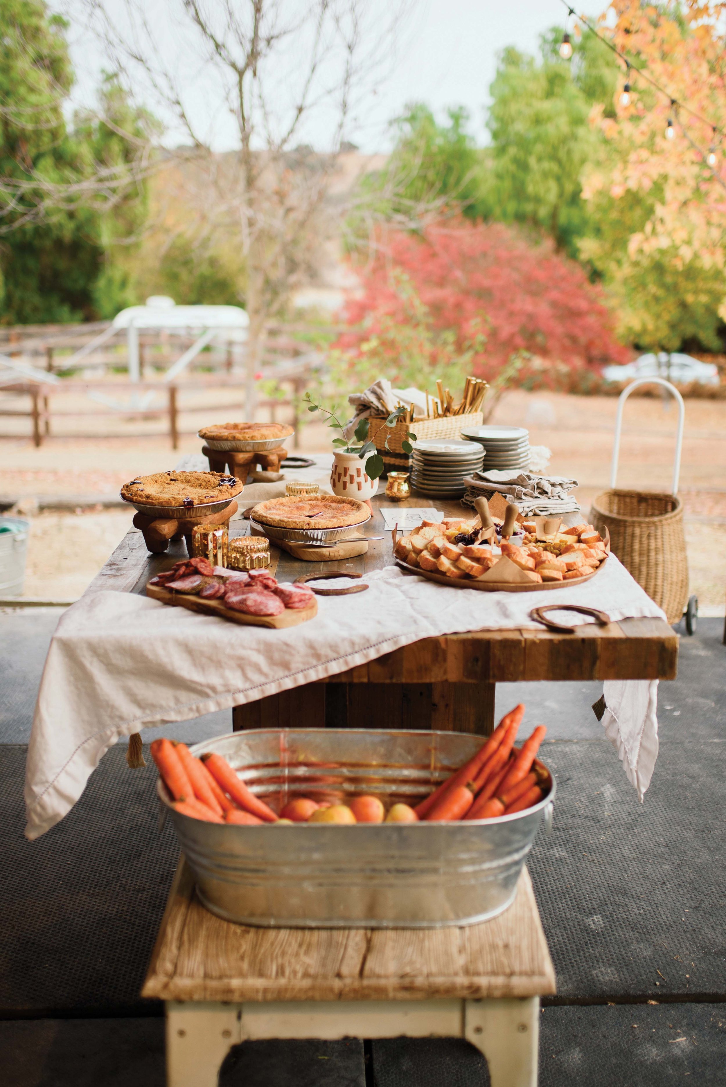  Local pies, produce, and wines are always on the table for Full Moon Farms gatherings. 