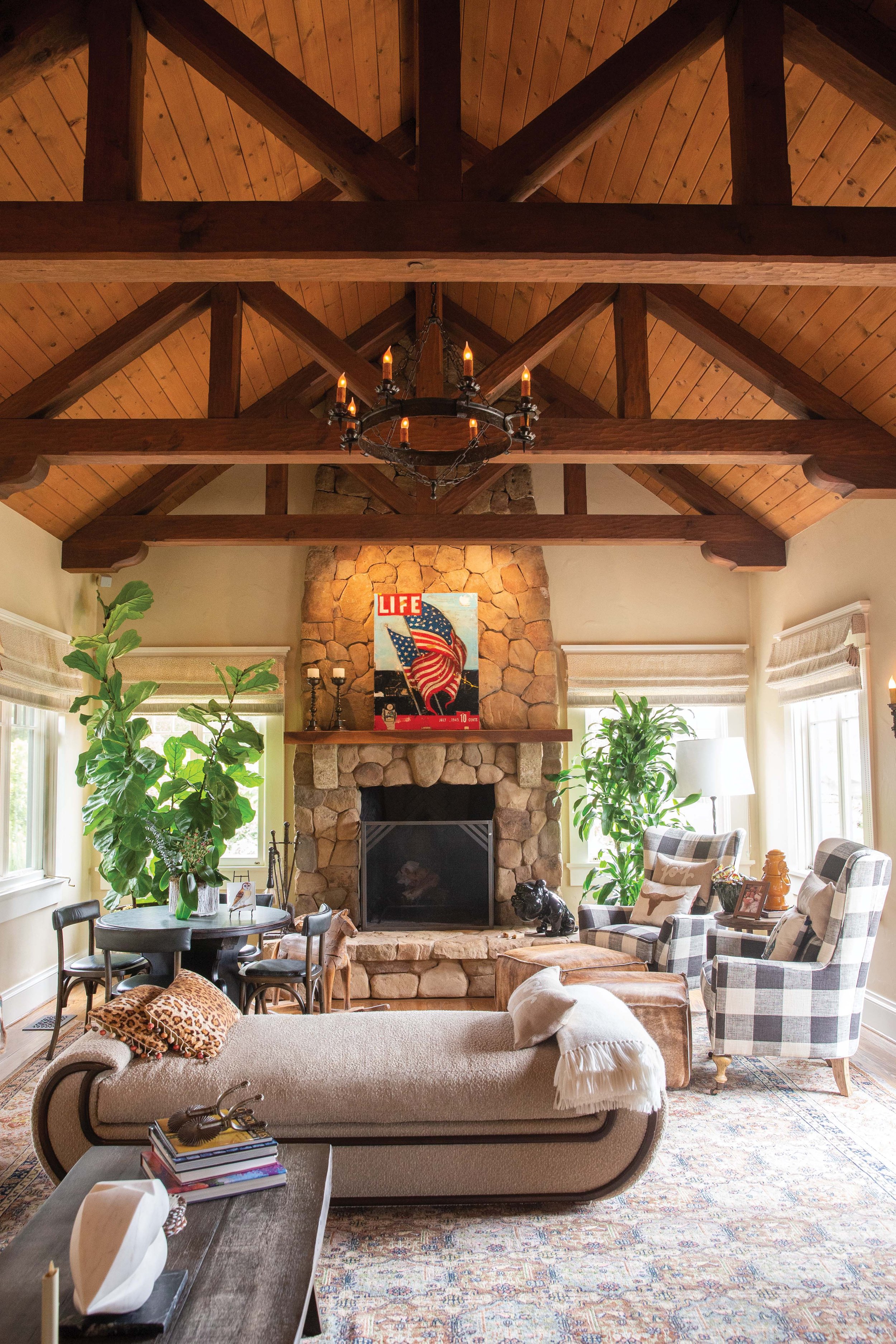  The feeling of homey comfort extends to the family room, where a stone fireplace dominates the room. 