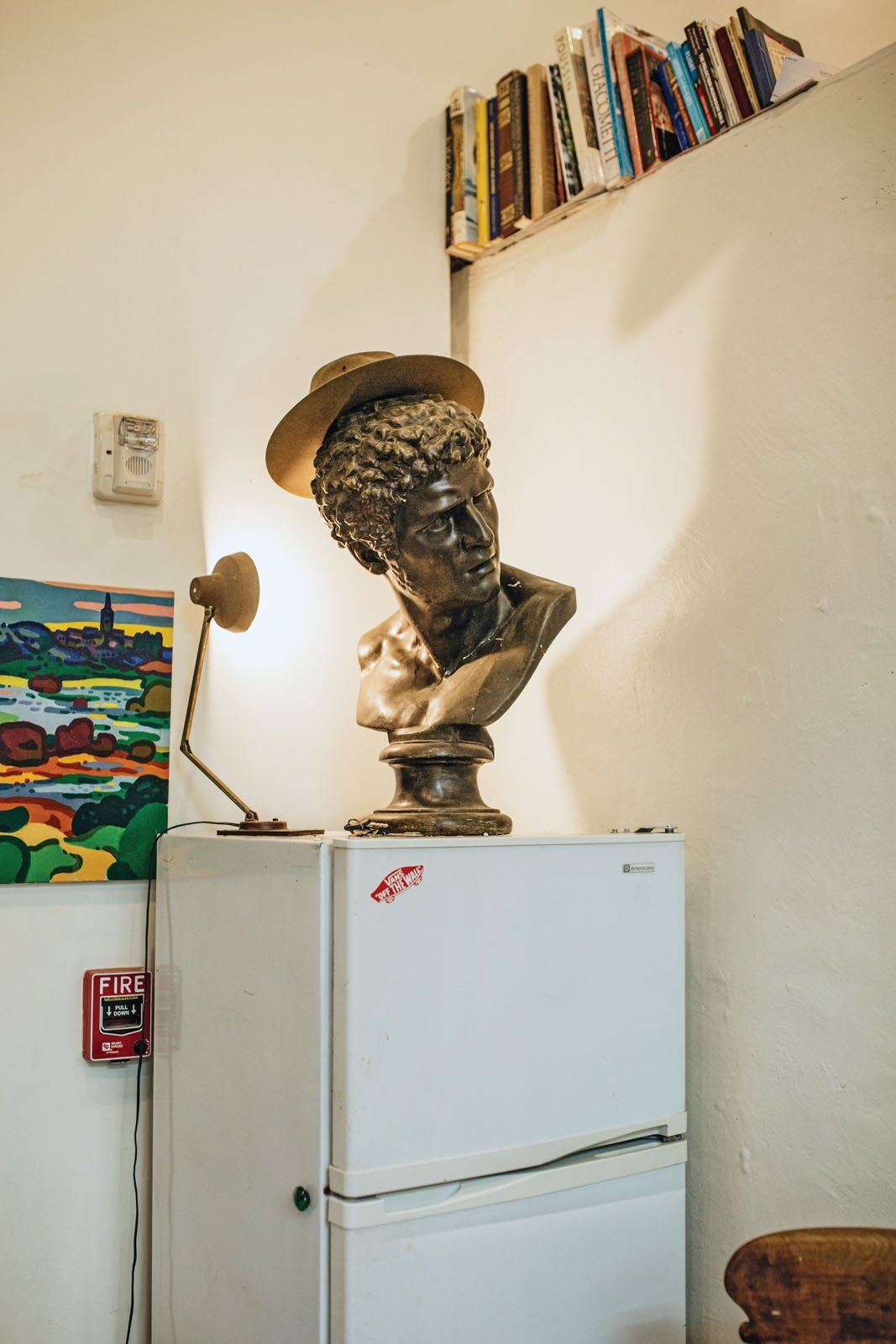  A whimsical display in a corner of the studio includes a bust purchased at El Rastro de Madrid. 