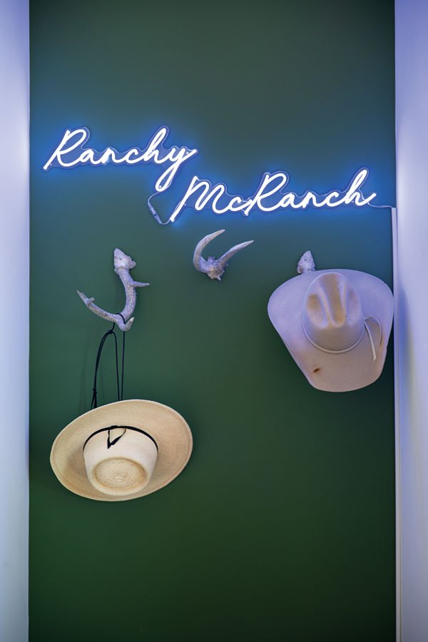  Paul dubbed their property Ranchy McRanch. Melissa created the hat rack from antlers sourced at a flea market. 