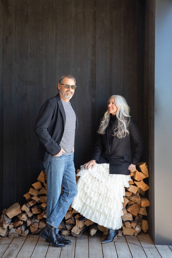  The striking couple outside their prefab home. Melissa wears a blouse from Brass Tack, her Santa Ynez boutique. 