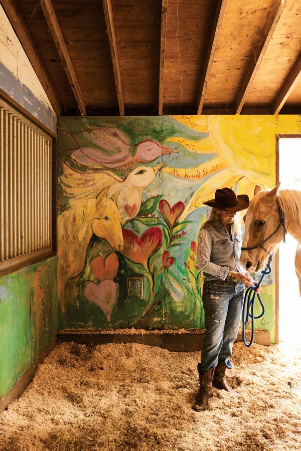  A horse named Neko is ushered into the barn, which features a hand-painted mural by MaHarry. 