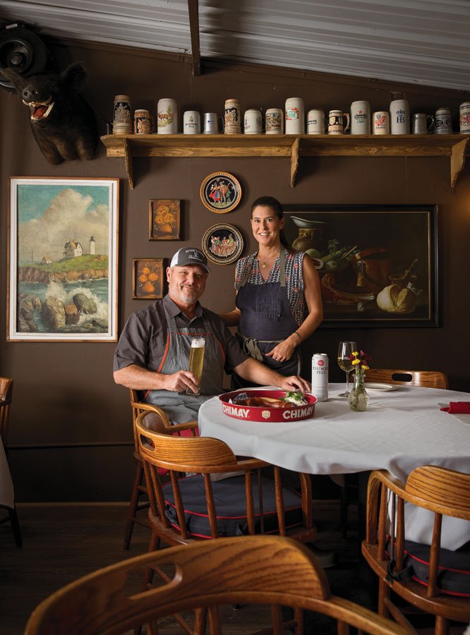  New co-owners Charlie and Jen Fredericks pose in the restaurant’s historic indoor dining room. 