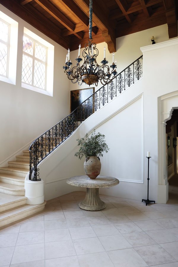 The entry hall features a grand staircase. Local designer Elizabeth Vallino has been assisting Abrams in furnishing the 12,000-sq.-ft. residence. 