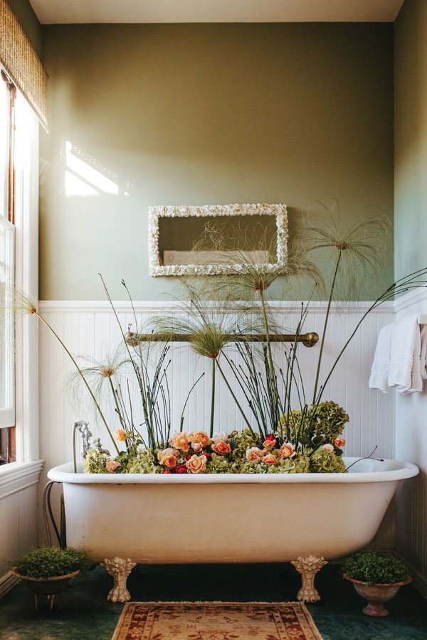  Coco Rose Design used pampas grass to add height and drama to the flowers in an upstairs guest bath. 