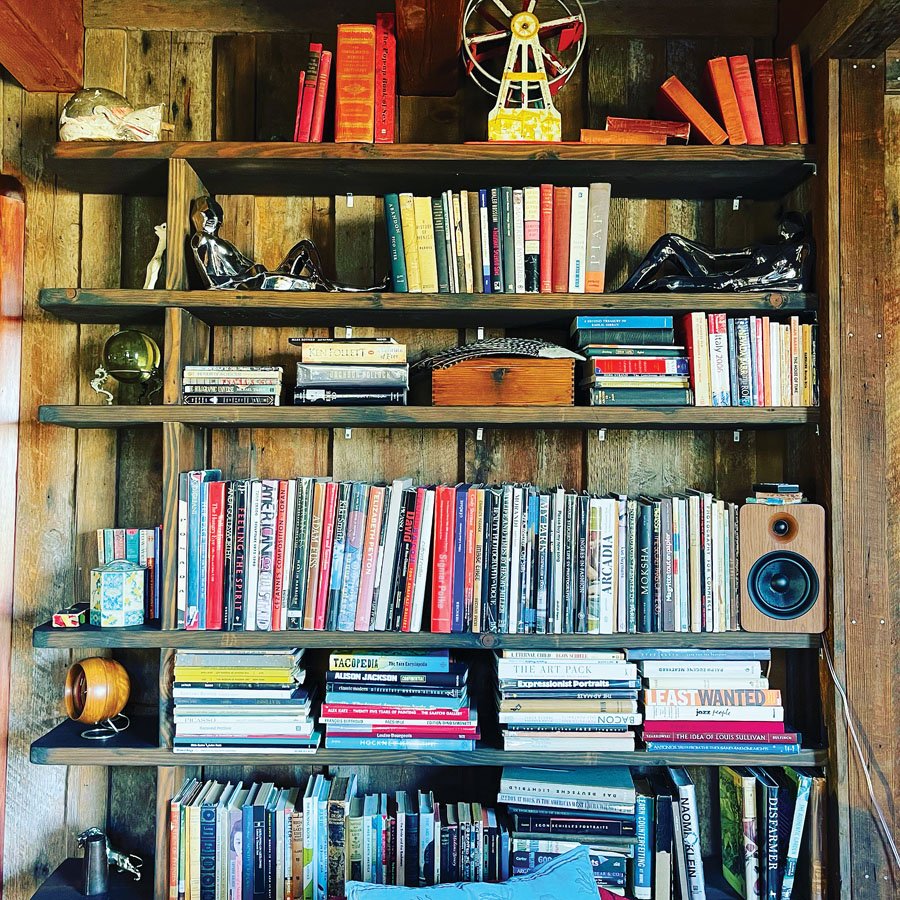  A wall of books and tchotchkes adds color and style to the main lodge. 