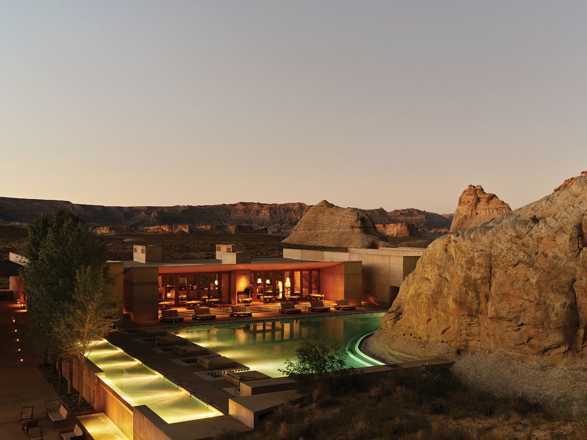  A natural rock formation blends into the property’s stunning central pool. 