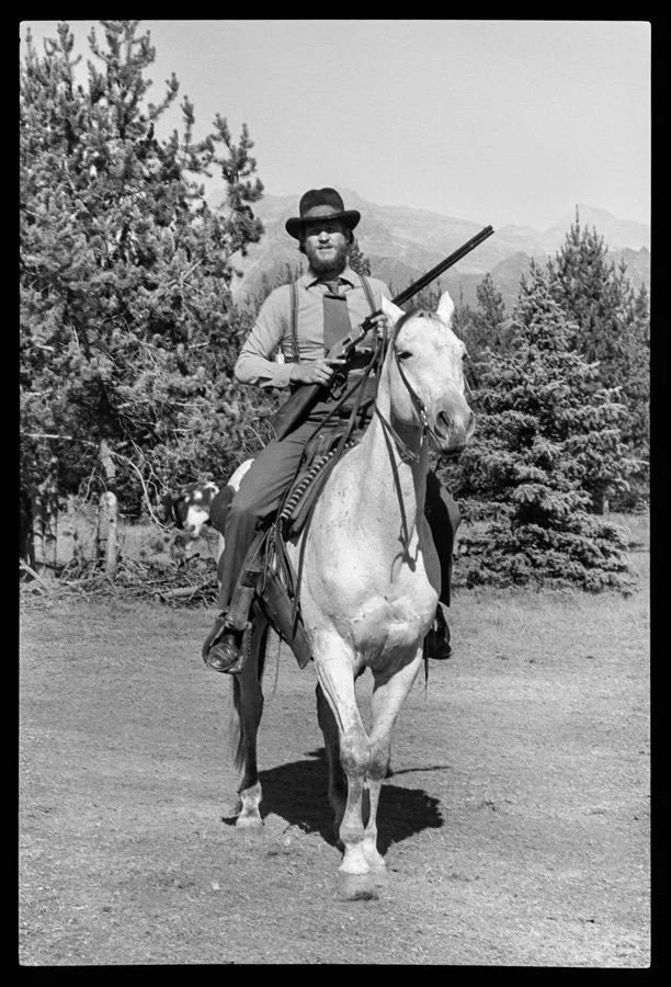  Bridges, as John L. Bridges, rides a horse named Dude. 