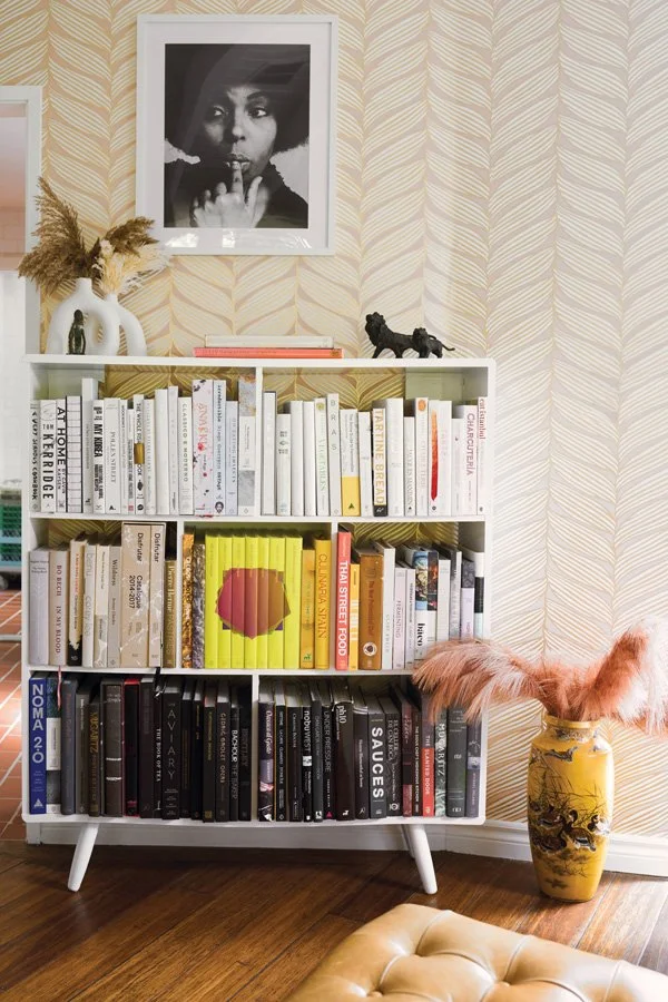  A sampling of chef and co-owner Perfecte Rocher’s cookbook collection. 