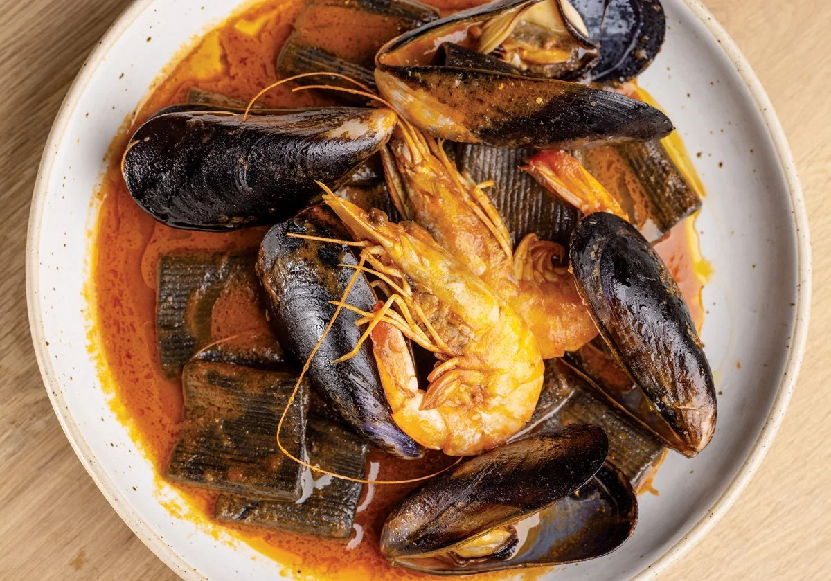  The menu highlights seafood and the rich culinary traditions of the Basque Country. 