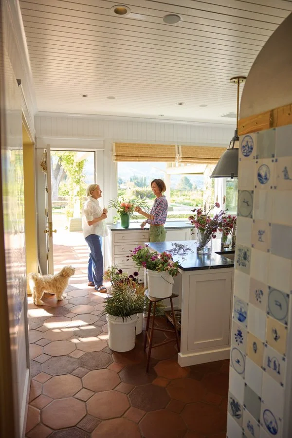  Crawford in the kitchen with Anna Oster of Amalgam Flora. 