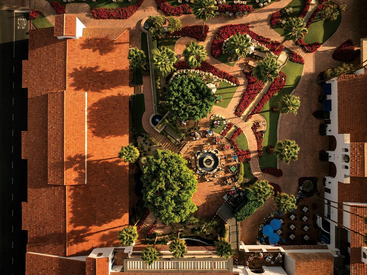  Red-tiled roofs create a soft, signature glow under the desert su 