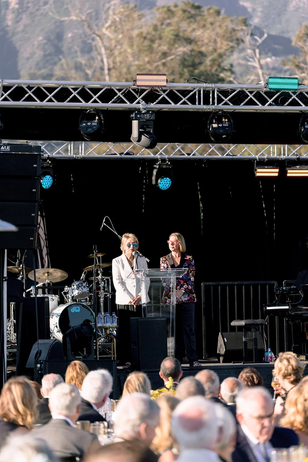  2026 Music Note Gala Committee Co-Chairs Andrea Hein and Rachael Douglas address guests at Bella Vista Estate (left to right). 