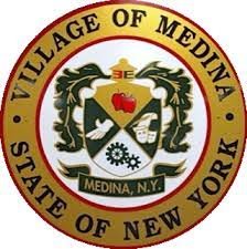 Seal of the Village of Medina, New York, featuring two dragons, a heart with a cross and a wheel, on a shield, with the text 'Village of Medina, State of New York' around it.
