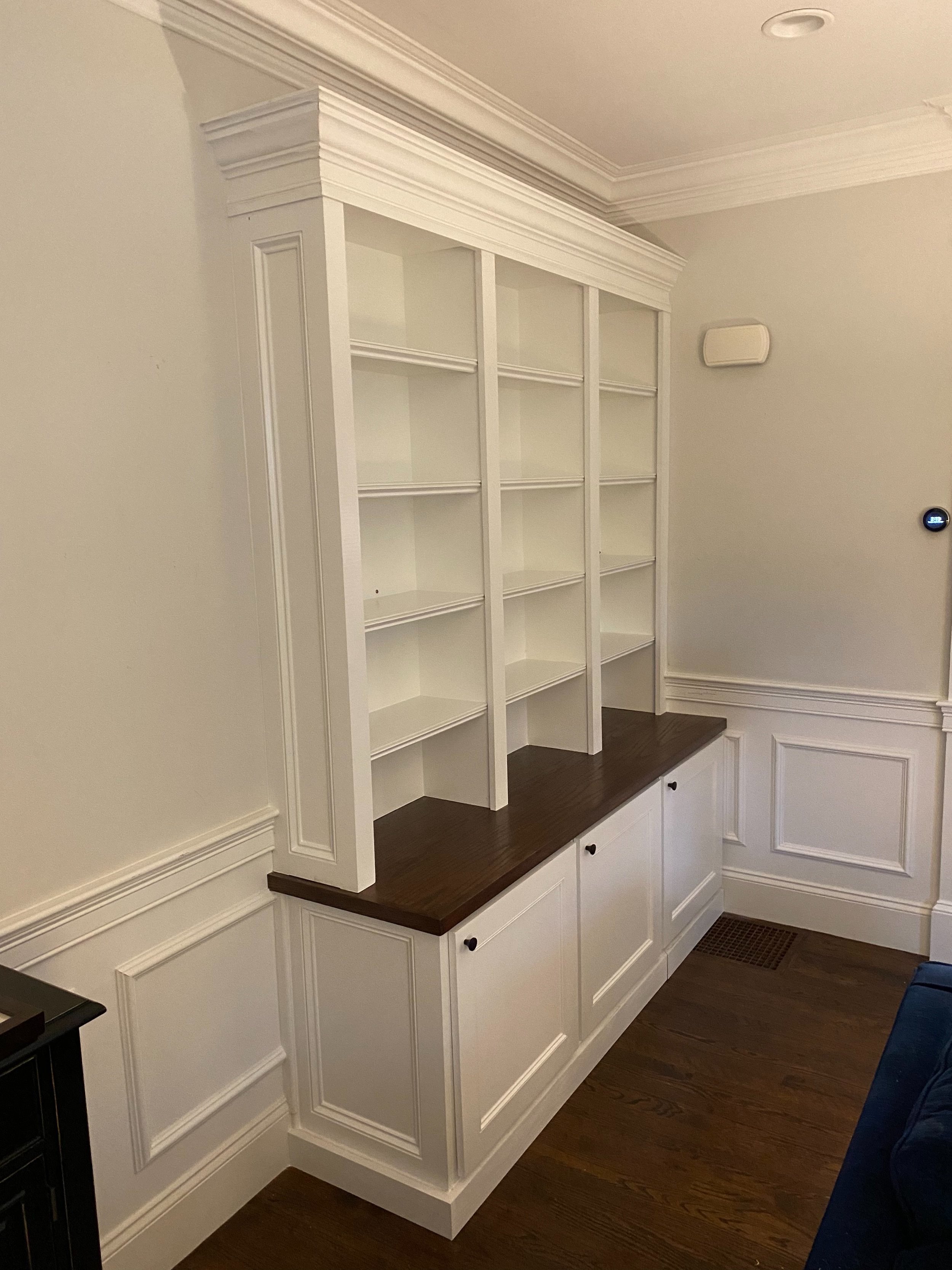 Cabinets and shelving tucked into an unused corner of the client’s living room.