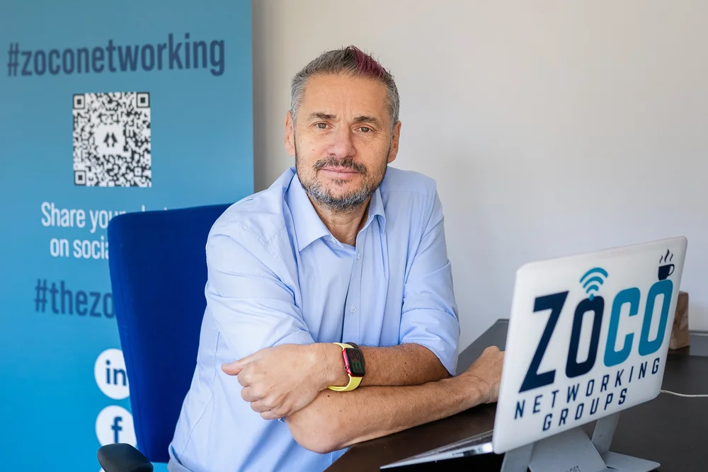 Nick Blanchard, founder of Zoco Networking, at his desk in Hampton