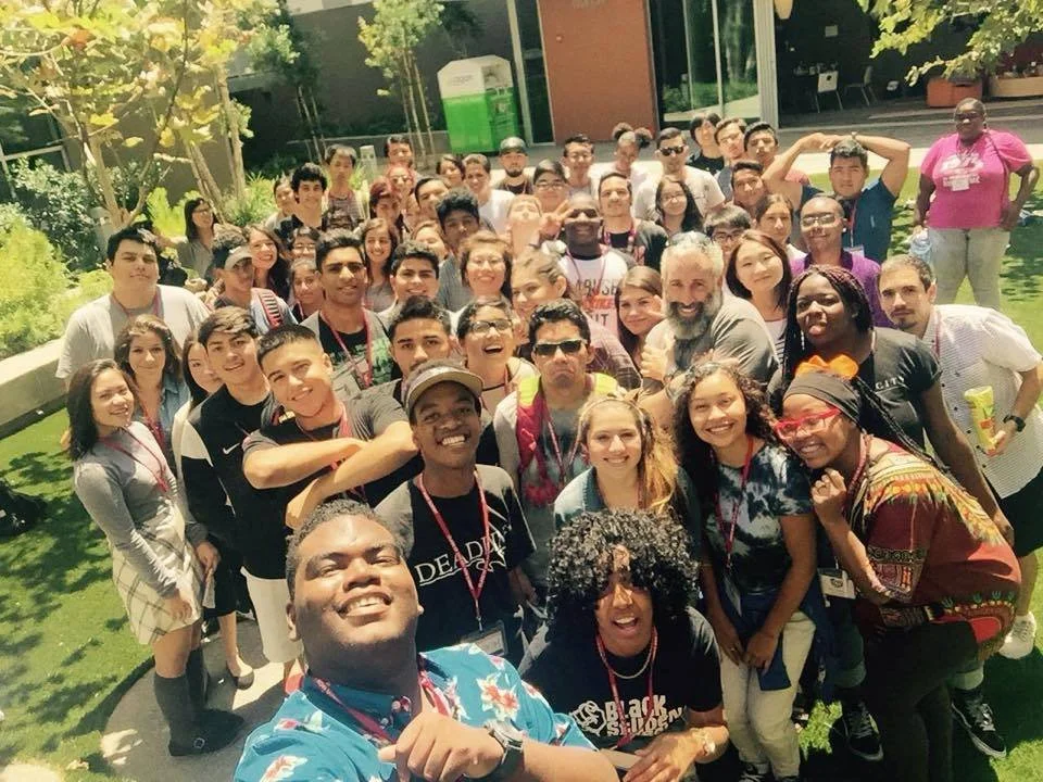 Students posing for picture on college campus