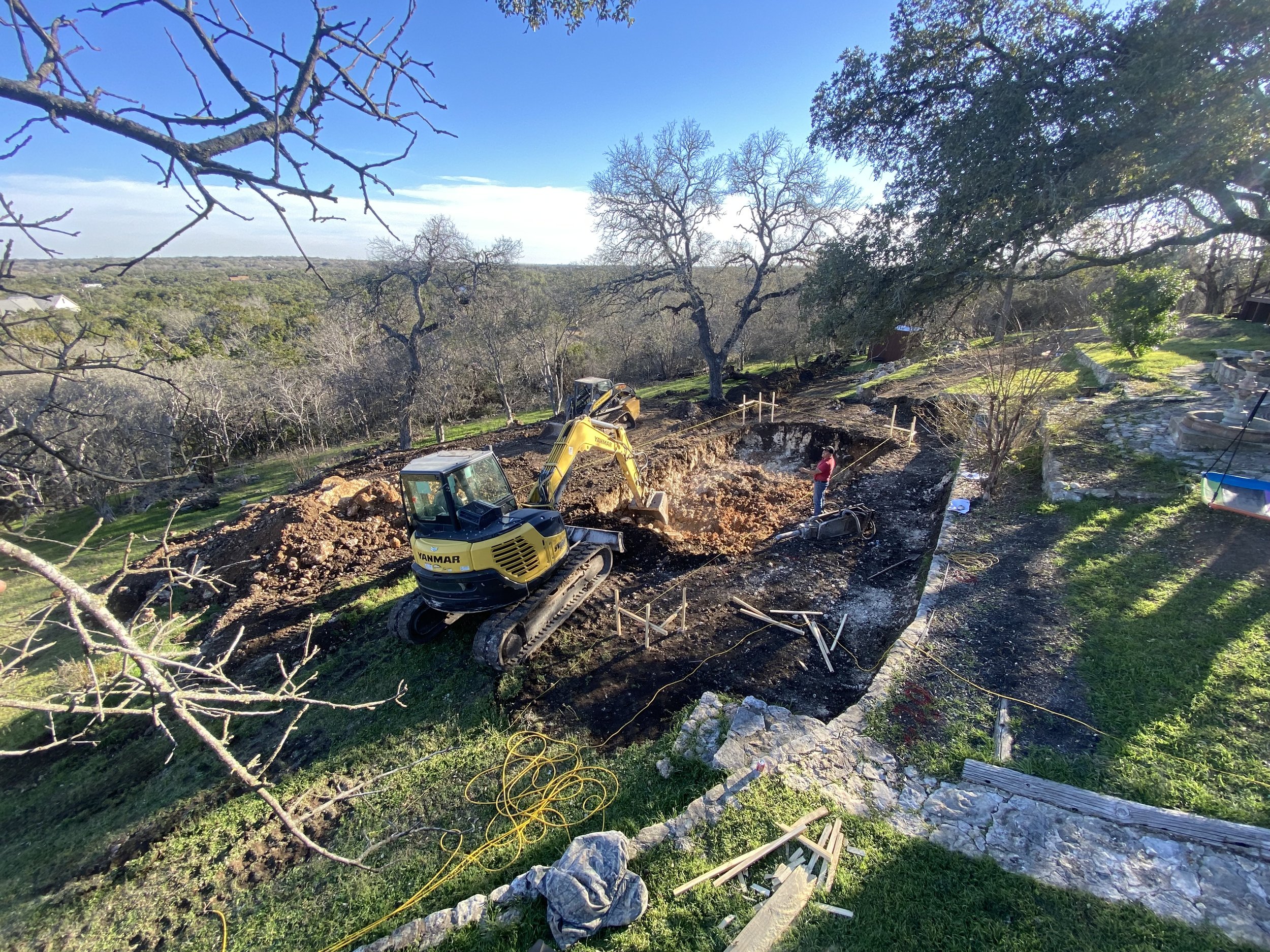 Pool excavation through limestone bedrock common in Austin area soil