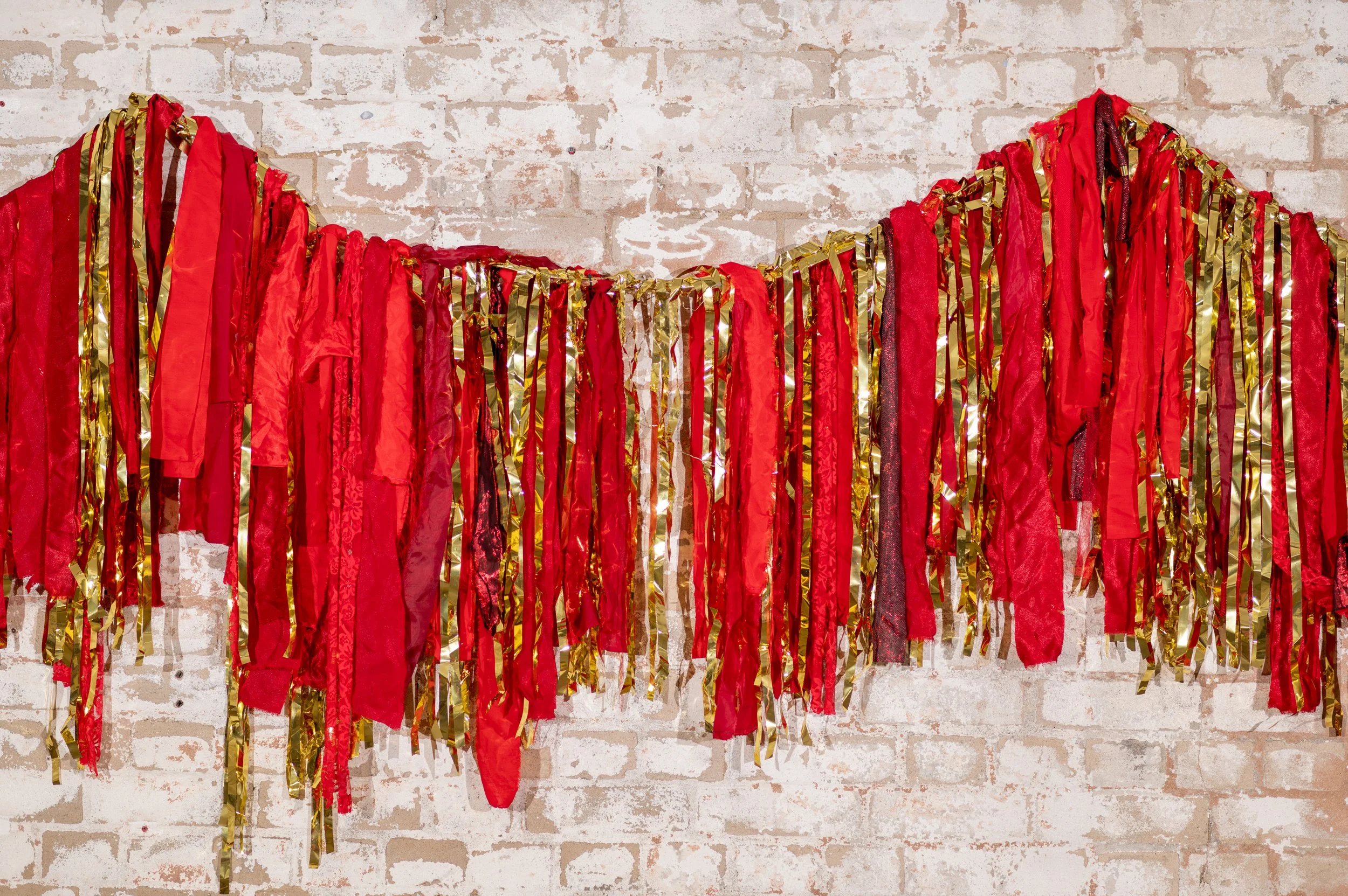RED WITH GOLD ADS ON