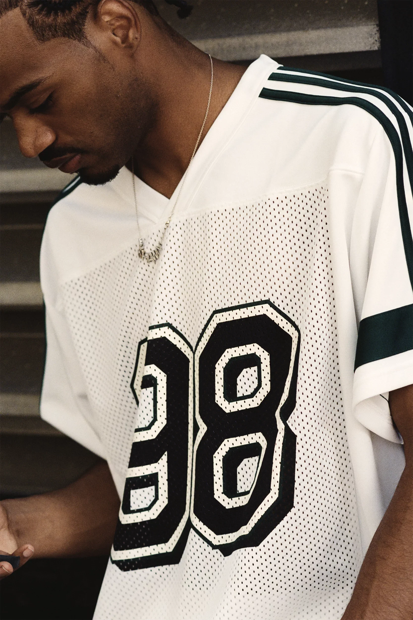adidas-tyshawn-jersey-white-ice-gold-metallic-collegiate-green-2.webp