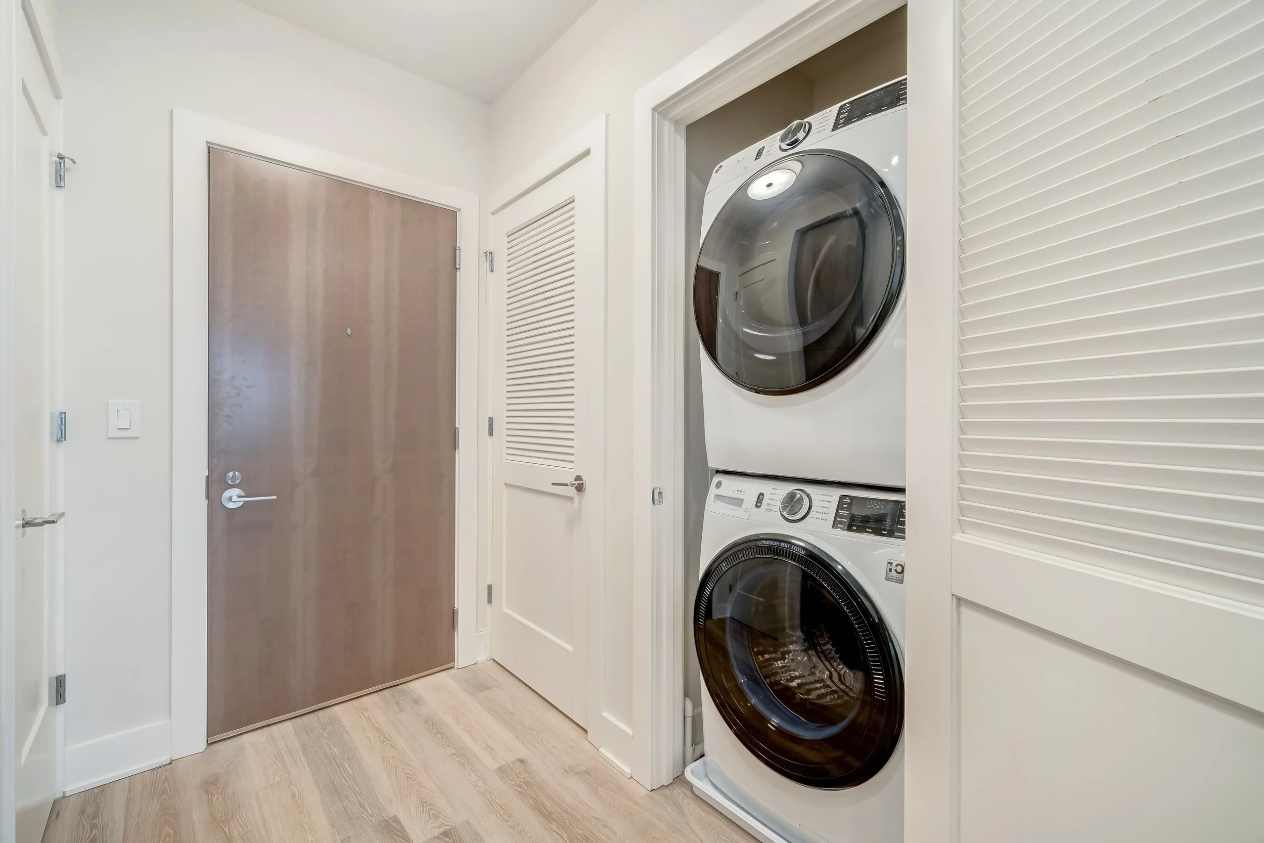 The ease and convenience of GE full-size stacked front load washer and dryer in your condominium.