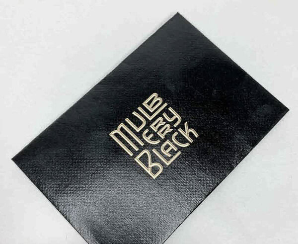 raised gold ink foil stamp black paper envelope.jpg