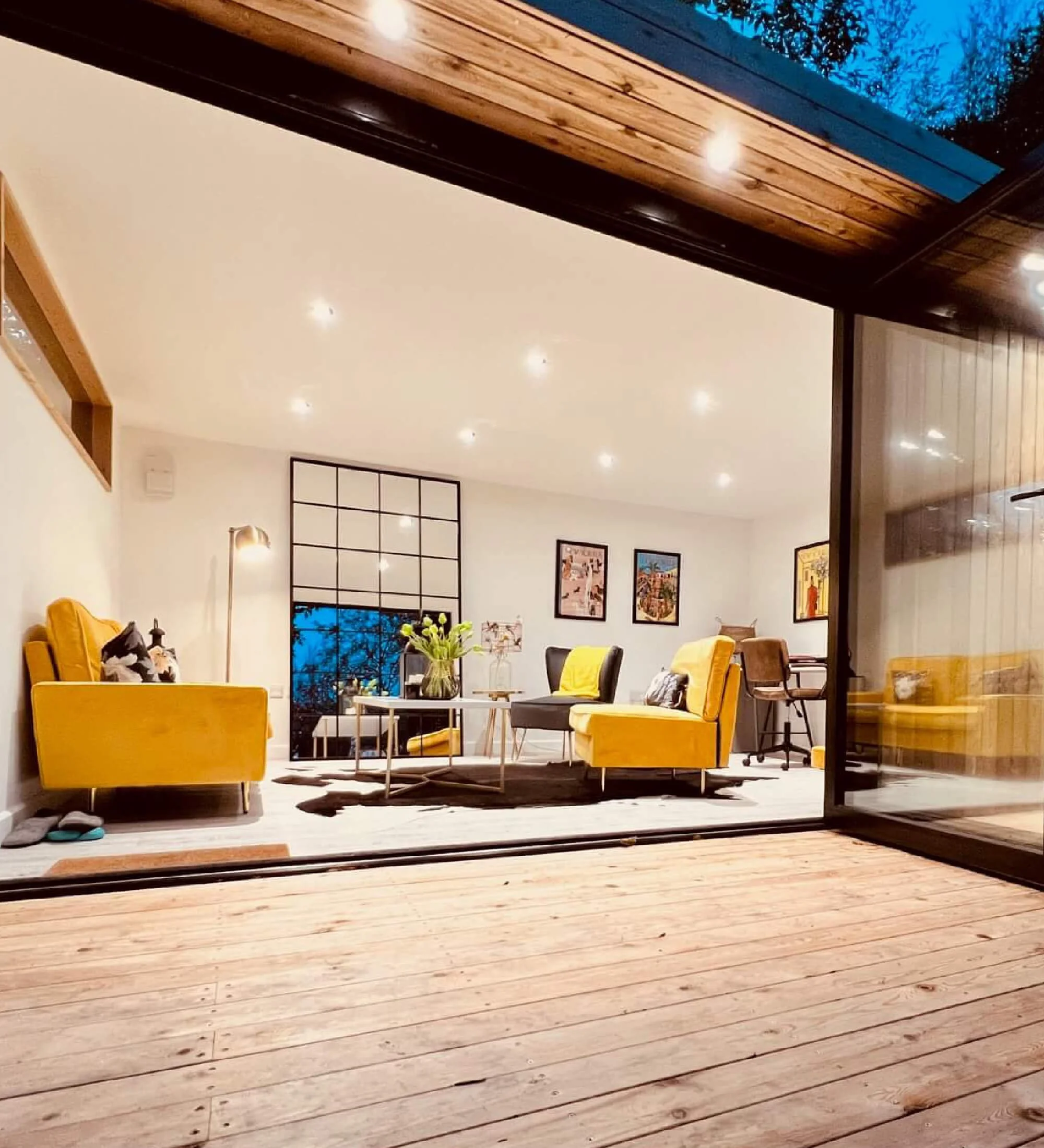 Light-filled garden room interior used as a home office, designed for comfort, space, and everyday usability