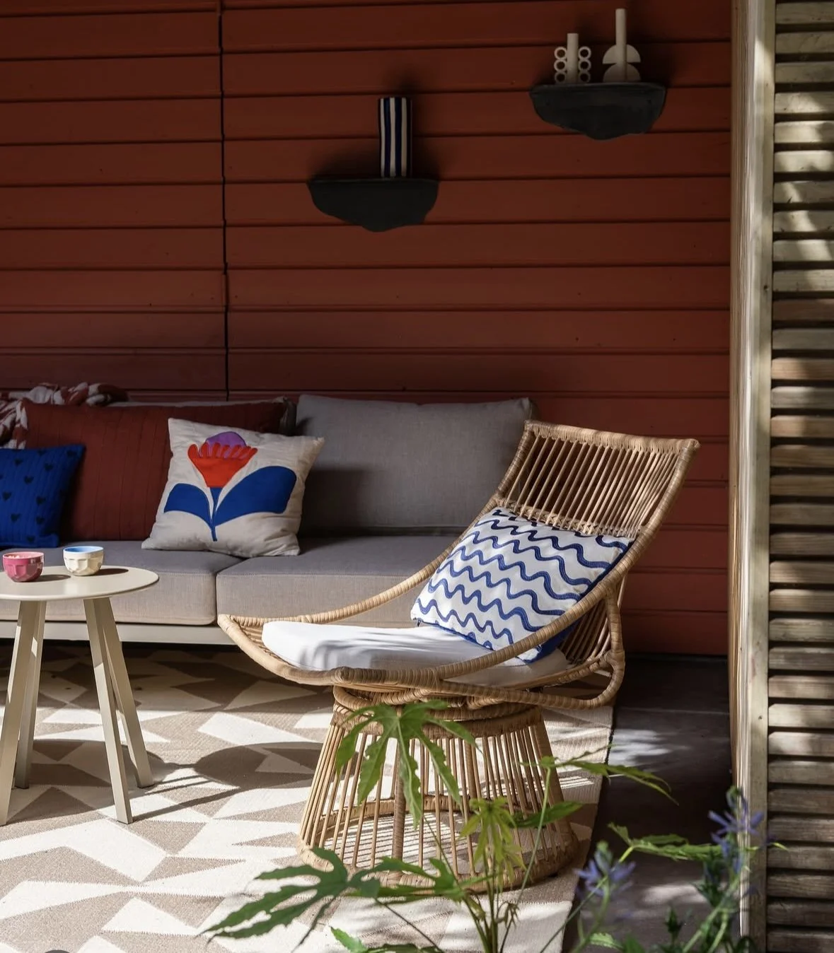Open garden room with outdoor sofa seating, creating a relaxed sheltered space for outdoor living