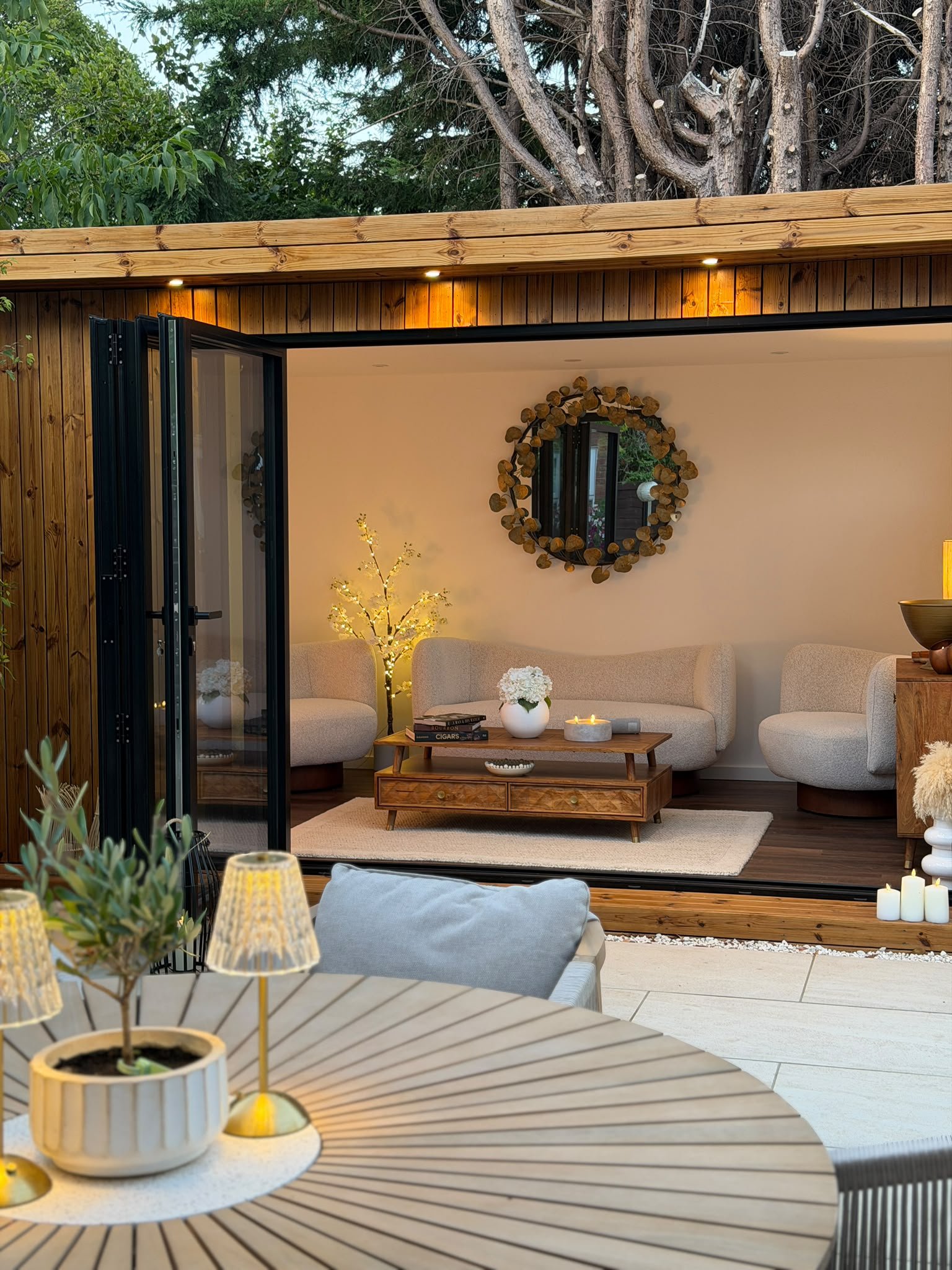 Corner opening detail showing seamless indoor-outdoor living in a modern timber garden room.