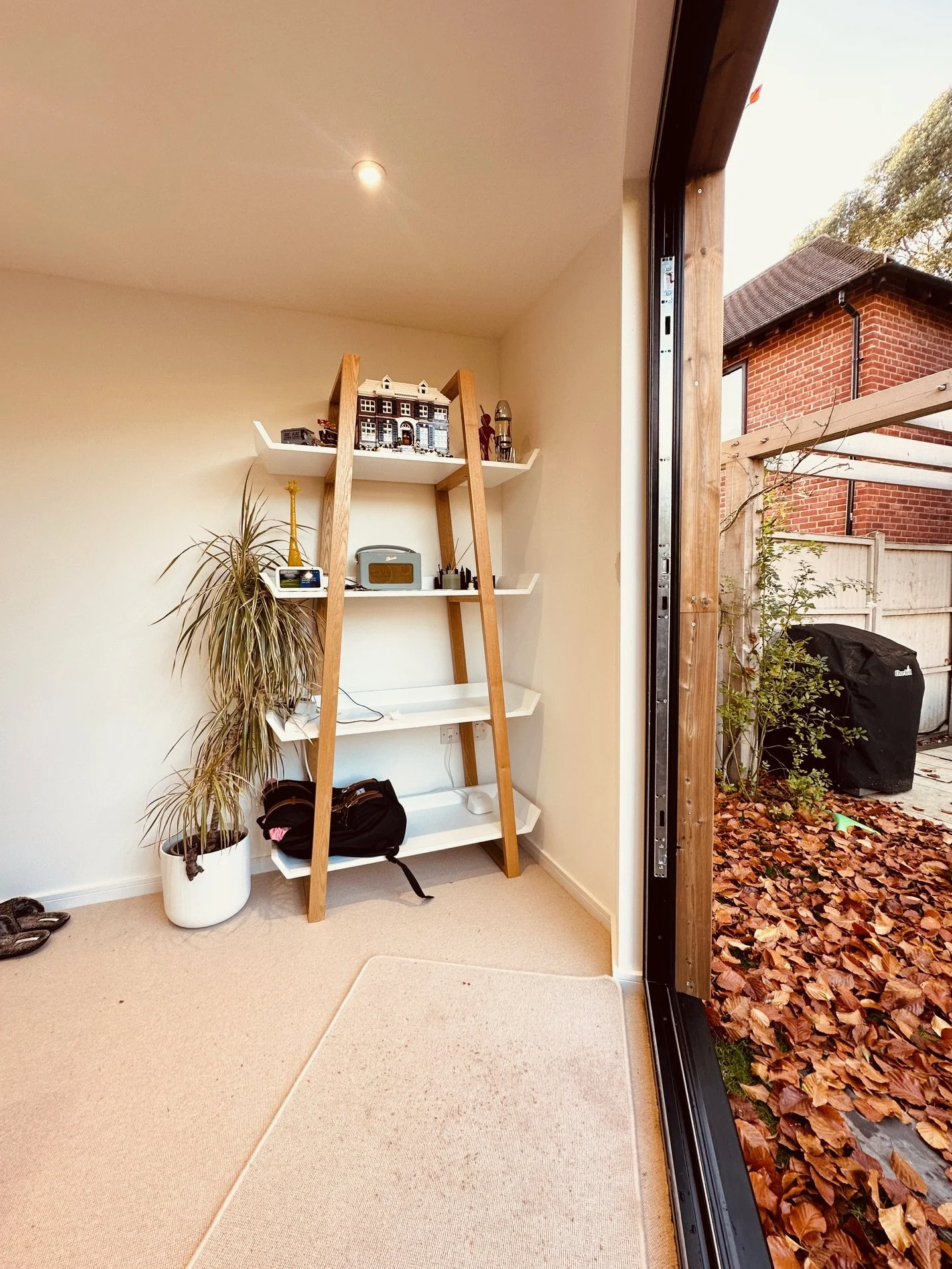 Interior of a modern garden room in Surrey used as a flexible home office space