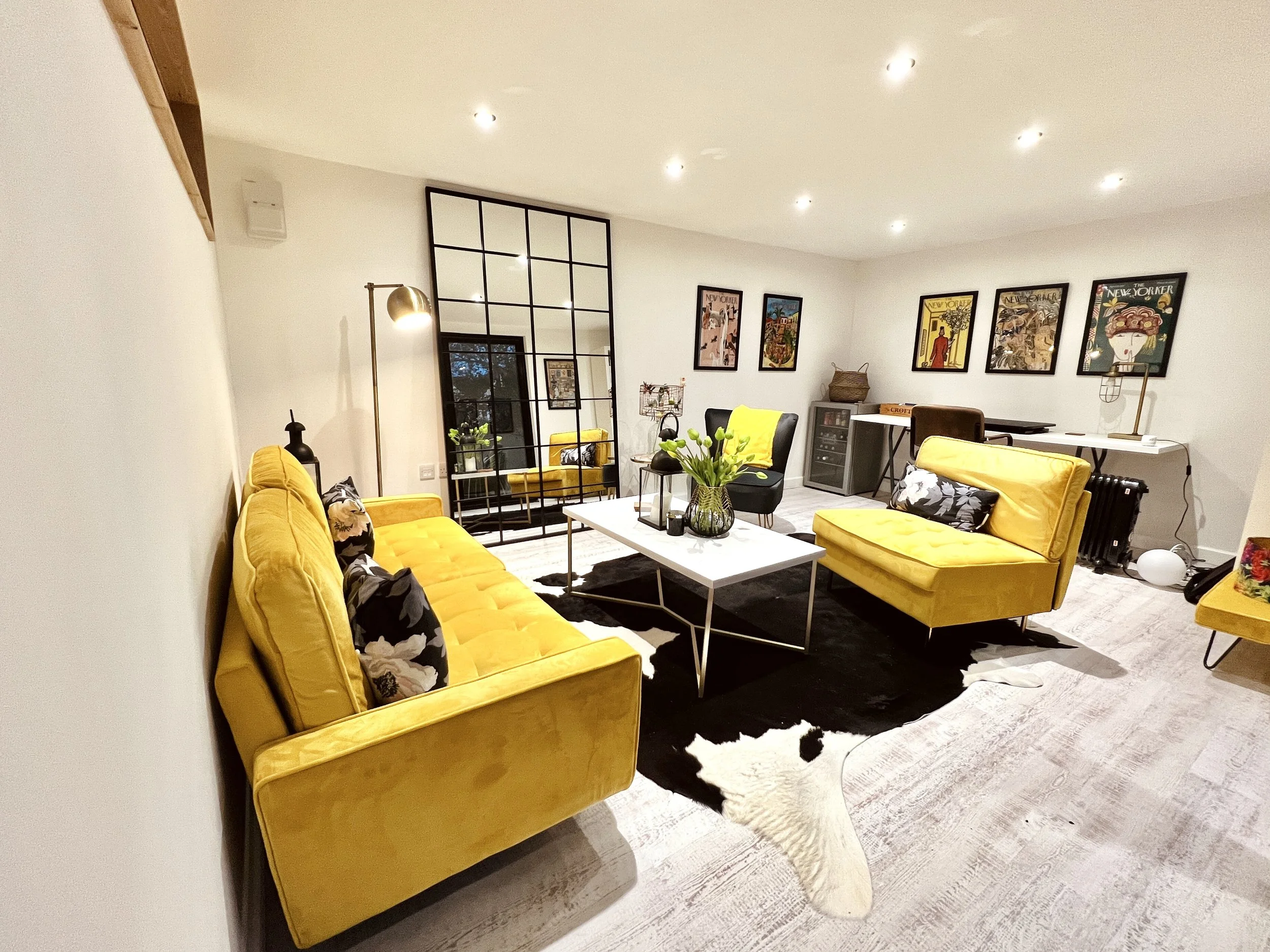 Interior view of the LUNA 5m x 4m garden room showing a styled, flexible space used for both work and relaxation