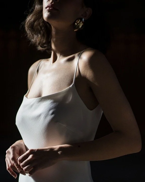 The Viola Dress. Simplicity itself. The Viola Dress is the ultimate in classic, understated elegance. Featuring subtle asymmetrical seams, and a dramatic train, which has a hidden wrist loop and ribbon ties to hold or tie the train out of the way for