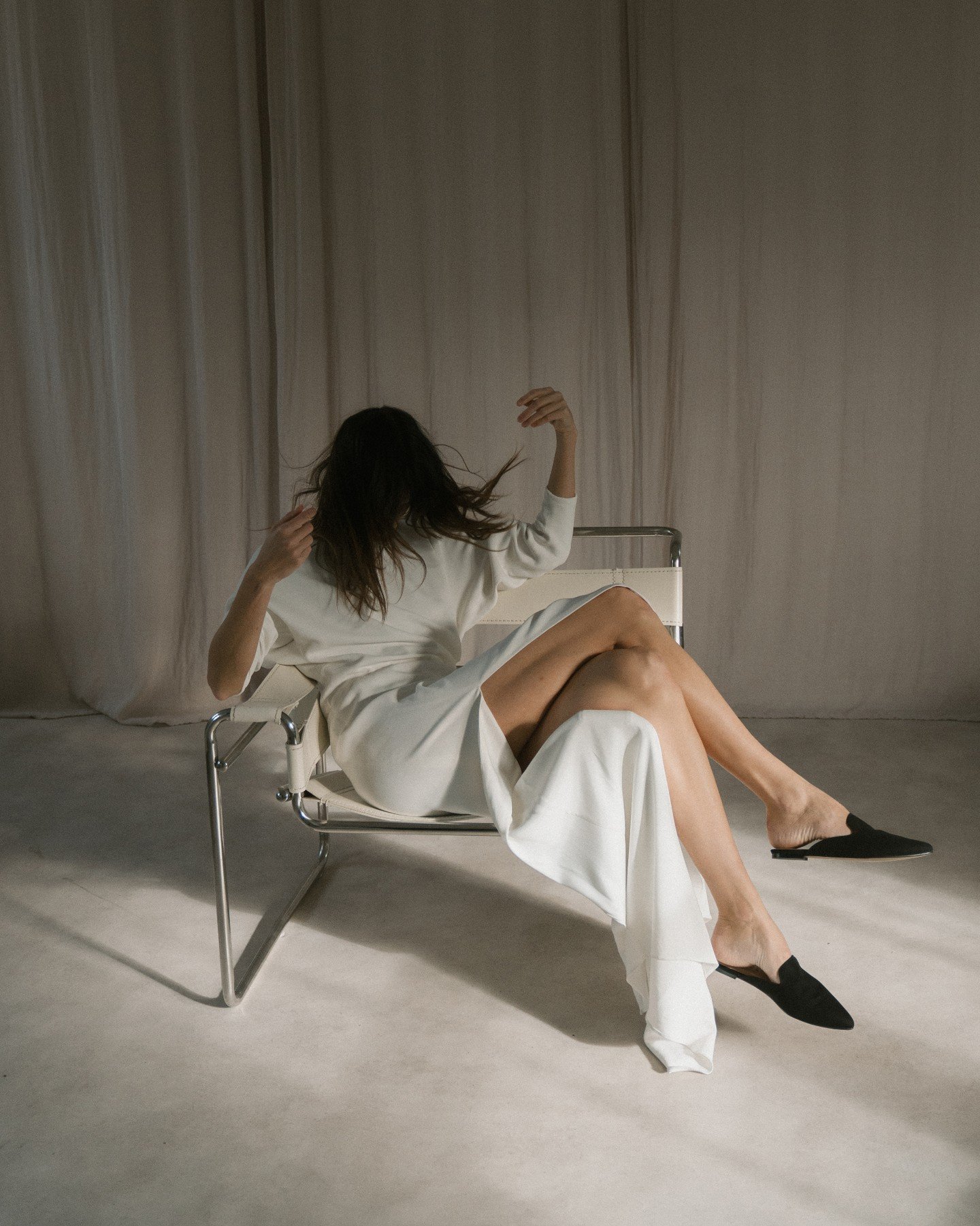 Meet the Nejire Dress. Sculptural, chic, and contemporary &mdash; cut from luxurious matte Italian cr&ecirc;pe and inspired by the innovative work of fashion cutter Tomoko Nakamichi. The bodice and sleeves are formed from a single piece of fabric, ex