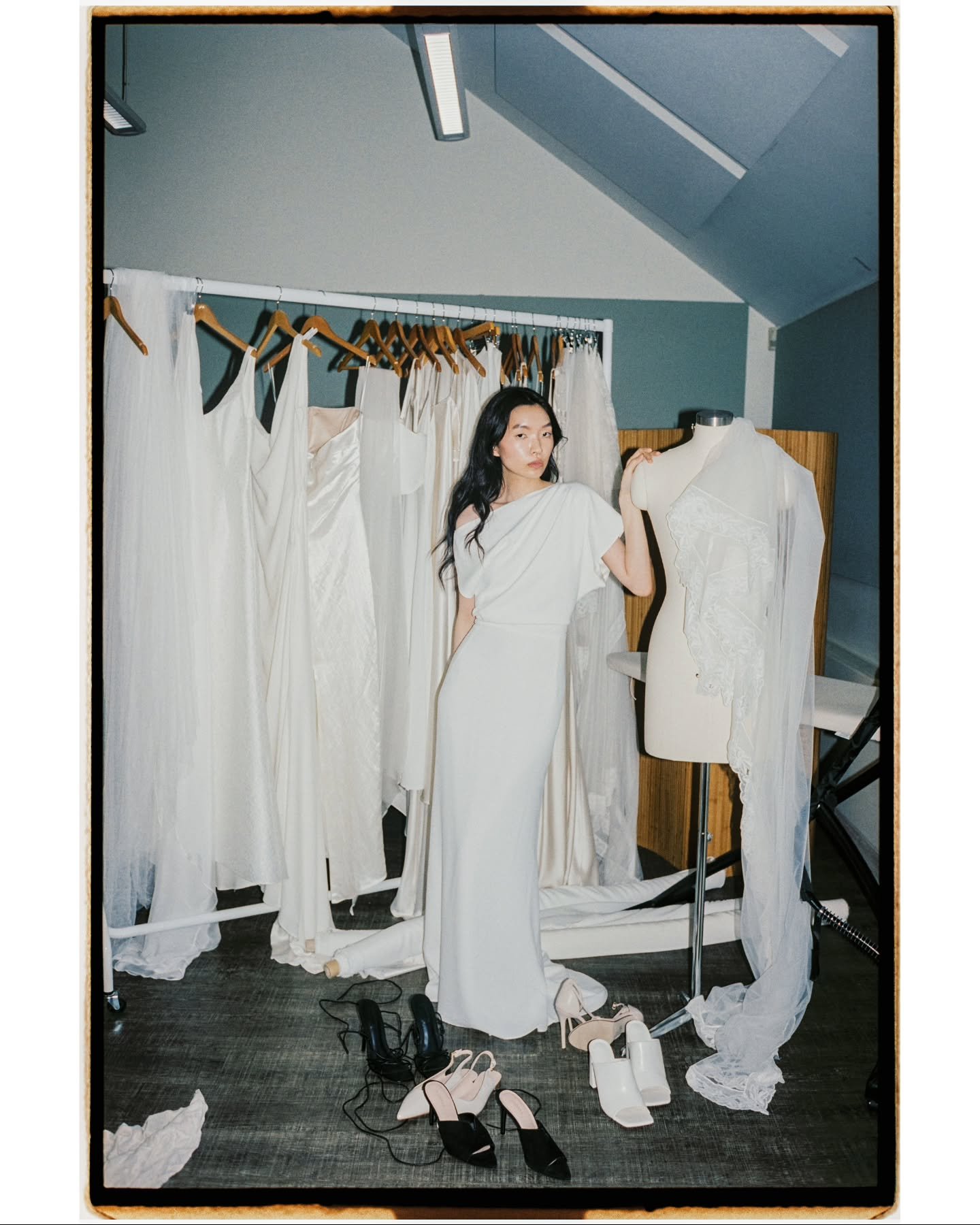 The beautiful Yunha wearing the Danaida Dress. A statement of subtle drapery, luxury cr&ecirc;pe forms sculptural folds of fabric that gently fall around the body. An asymmetrical neckline and off-shoulder fit combine to create a soft but striking co