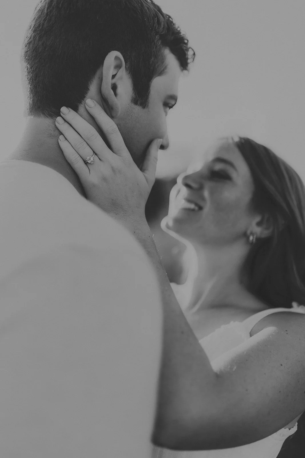 A black and white photo of a couple in a close, intimate moment during their engagement photography session at Rock Bridge State Park in Columbia, MO.