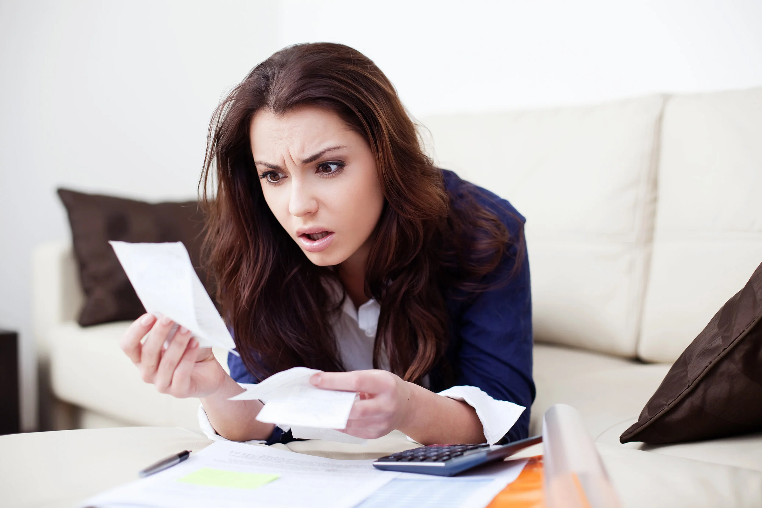 Scenic shot of the beach with waves hitting the rocks.