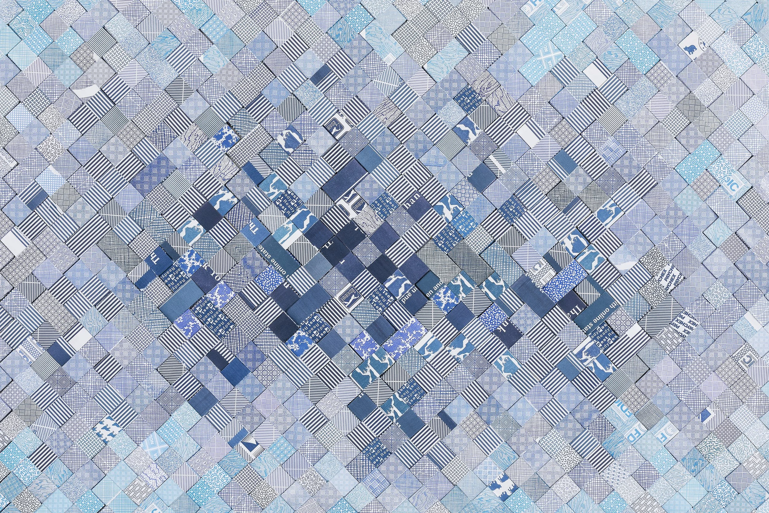 A mosaic of small square tiles in various shades of blue, gray, and white, with some tiles featuring patterns like stripes, checks, and abstract designs.