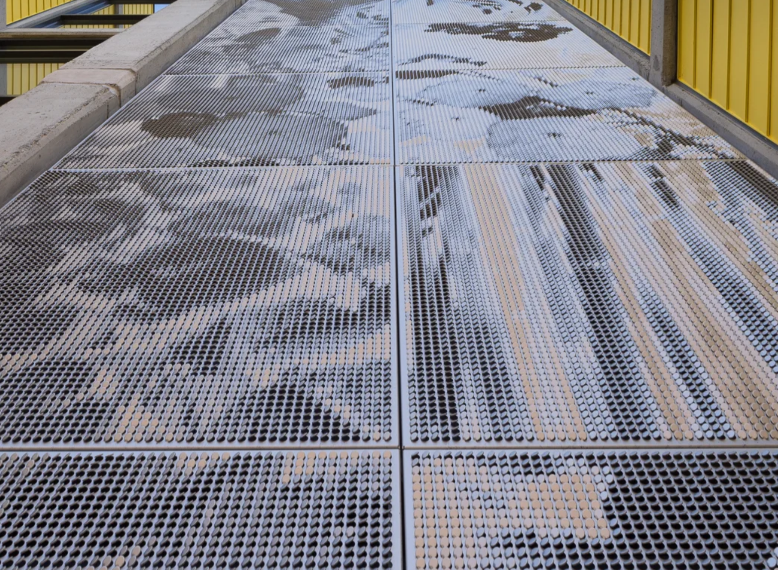 Walkway with a printed image of a soldier, with the American flag in the background.