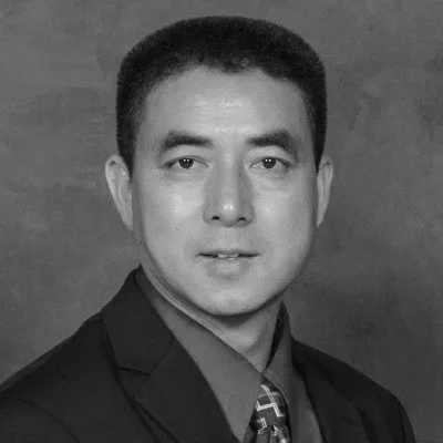 A portrait of a middle-aged man in black and white