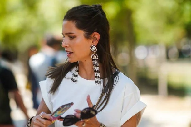 Long curtain earrings will catch the wind and whisk you away. With the foundation of a white t-shirt, this look is EFFORTLESSLY chic.