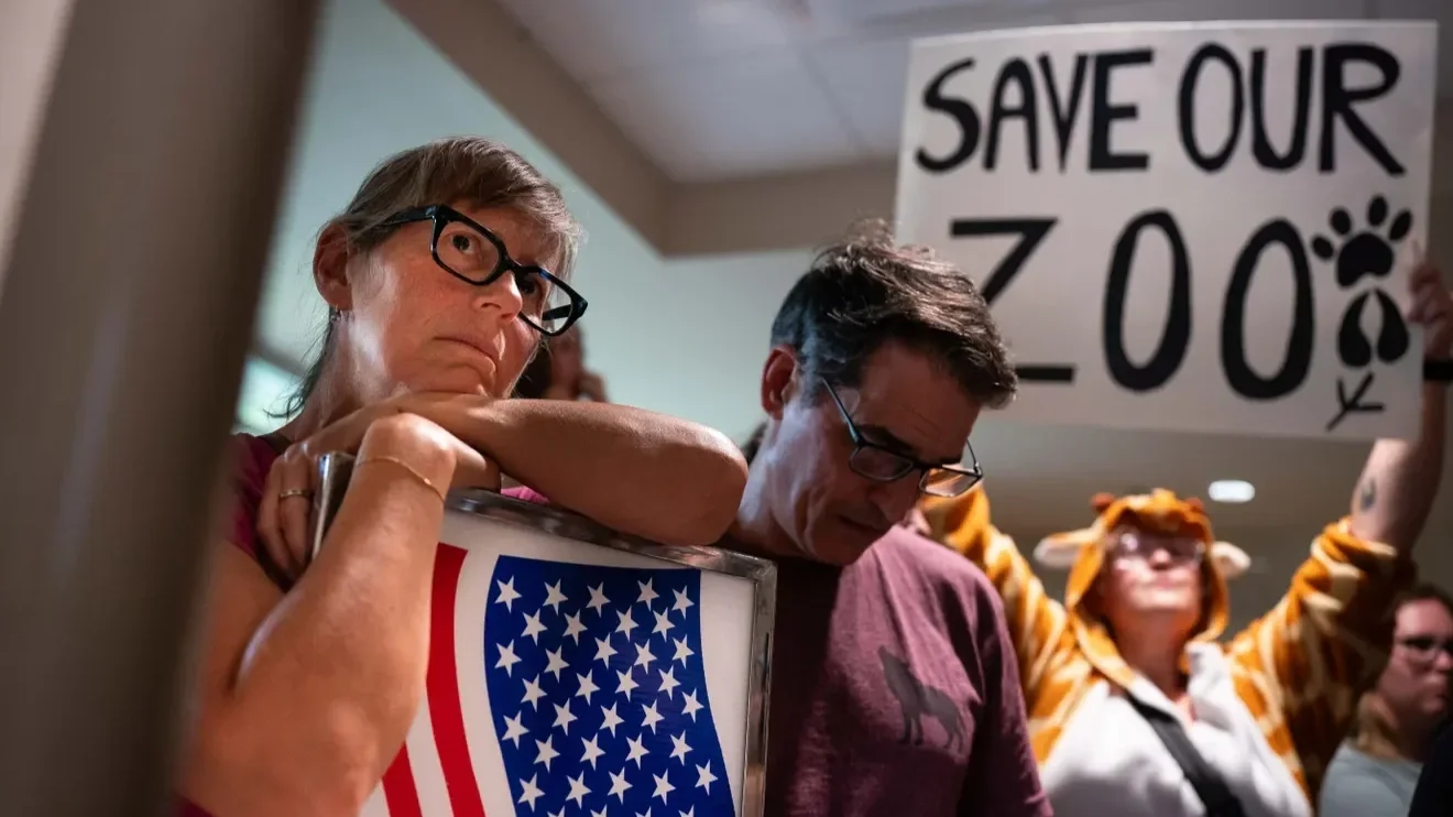 Ruth DiPietro and others protest the data center near Nashville Zoo. A person holds up a sign: Save our zoo