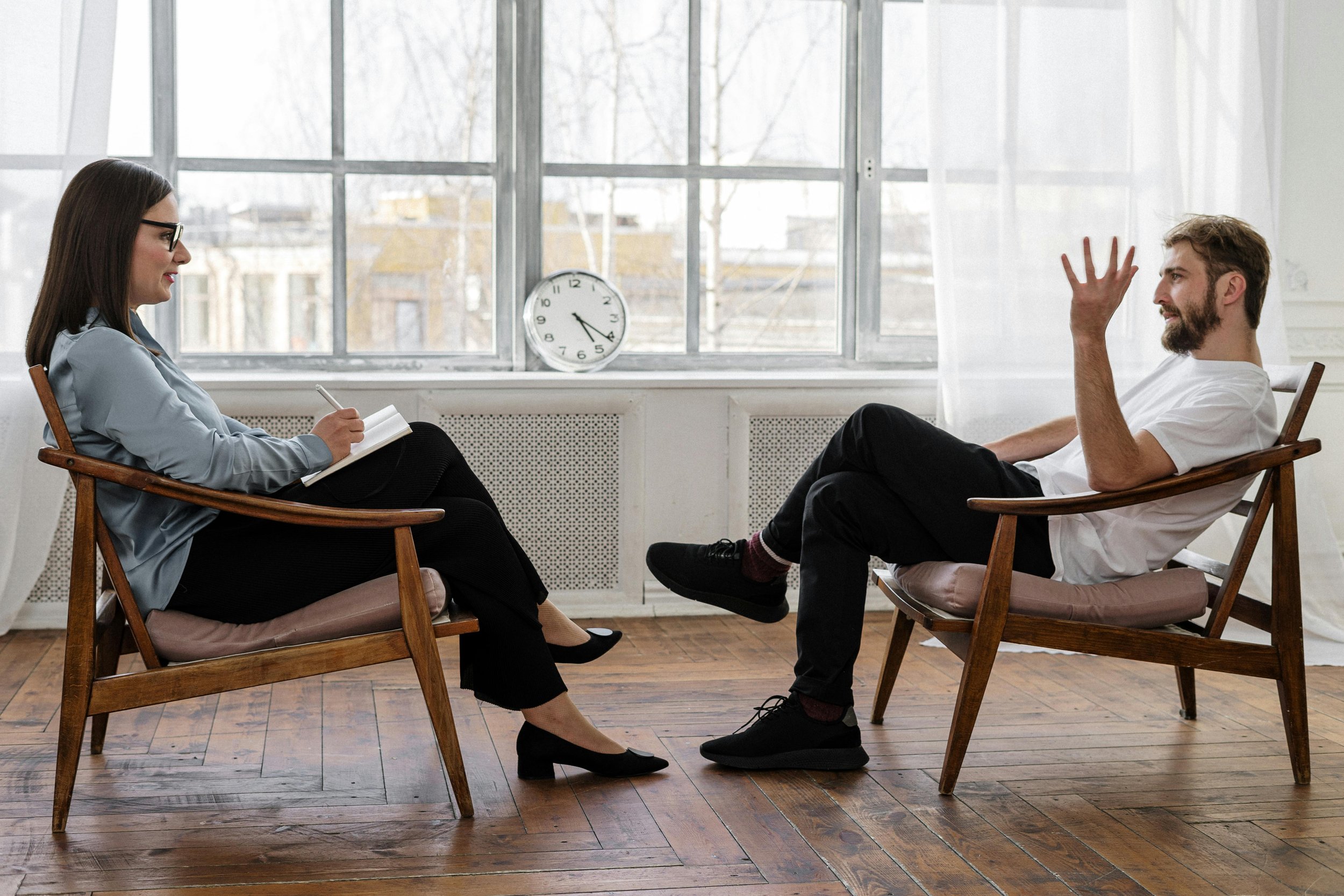 Photo of a trauma therapist giving trauma therapy in seattle to a client.