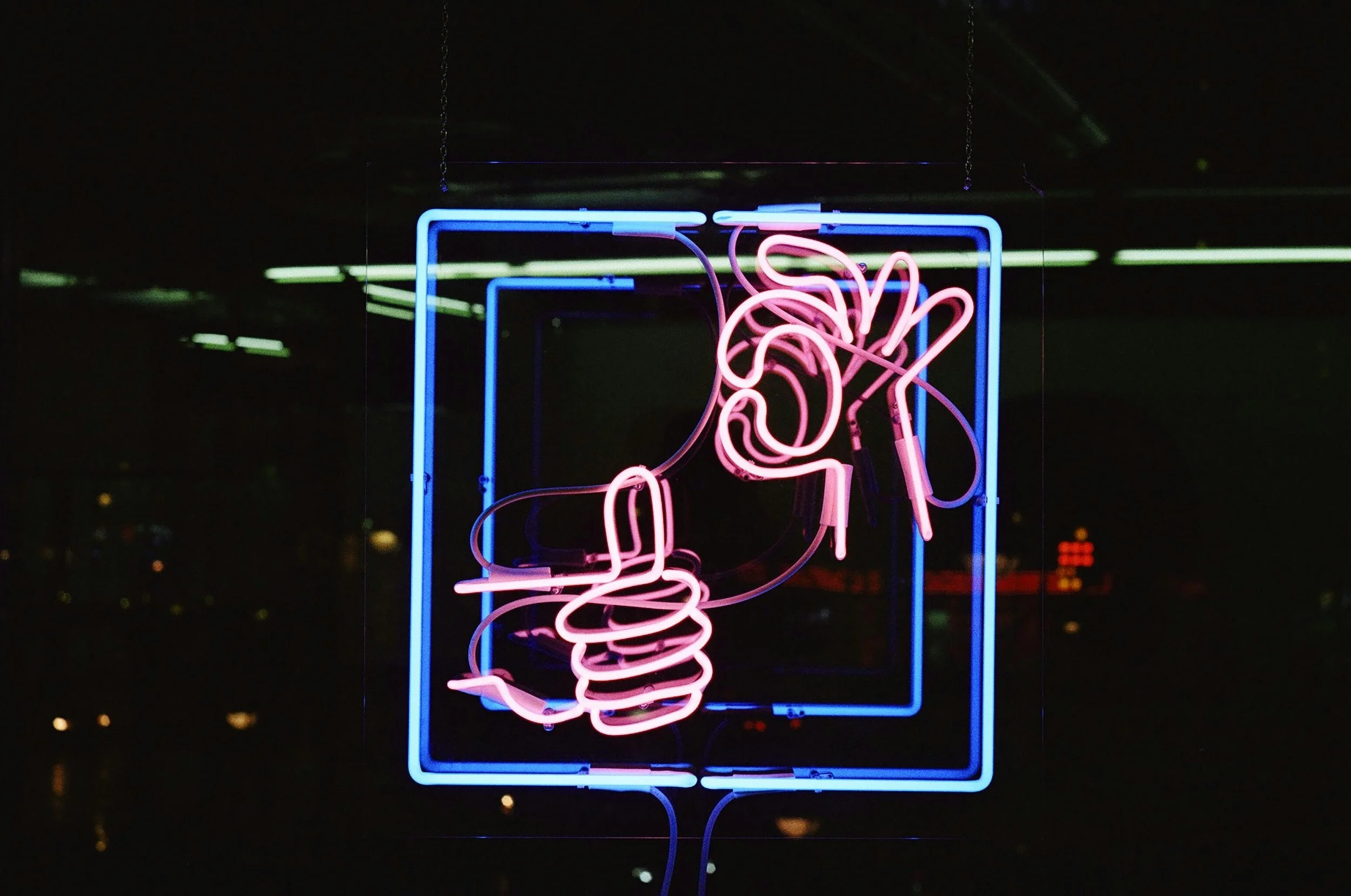 Image of a neon sign with "ok" and "thumbs up" indicating EMDR therapy in Seattle is right for me.