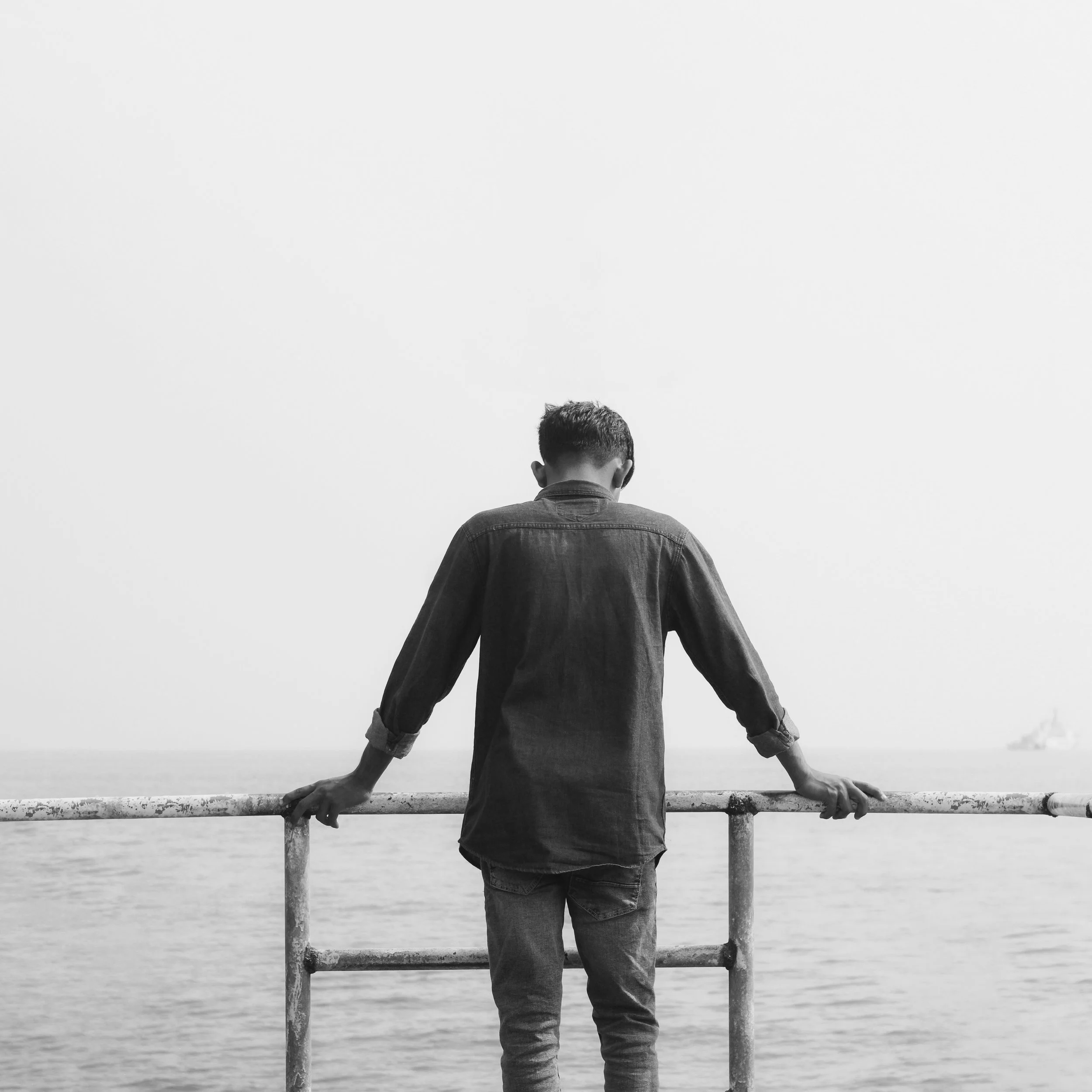 Image of a man looking out toward the water in need of working with EMDR therapist in Seattle.py