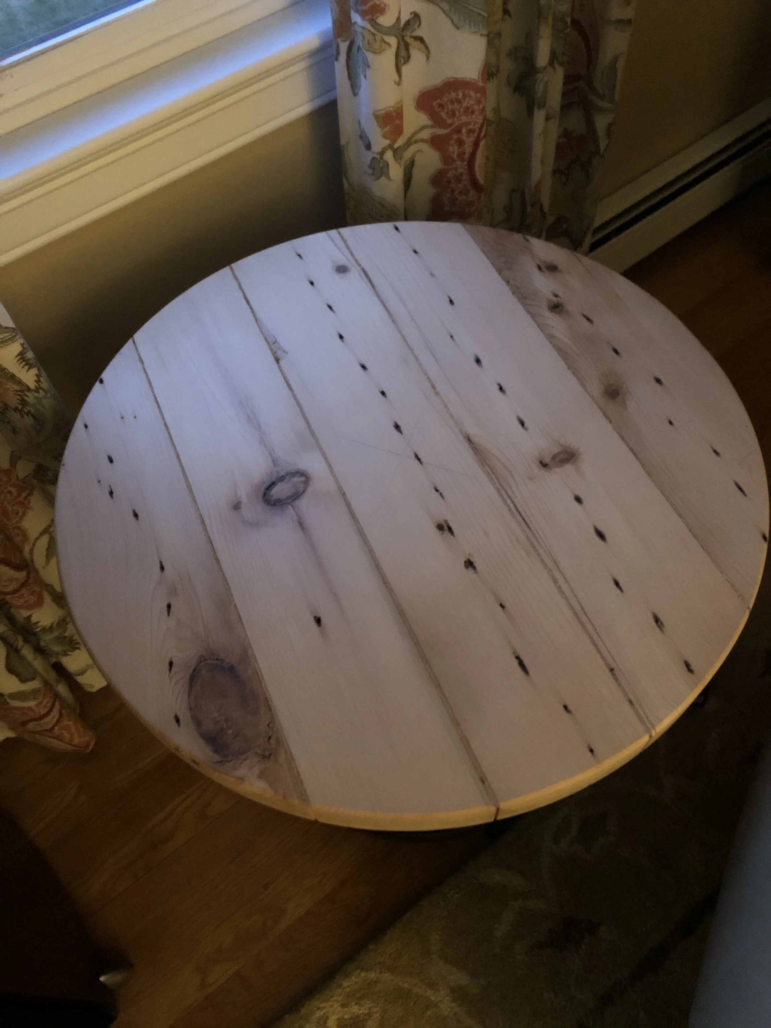 Reclaimed wood table. Notice the nail holes!