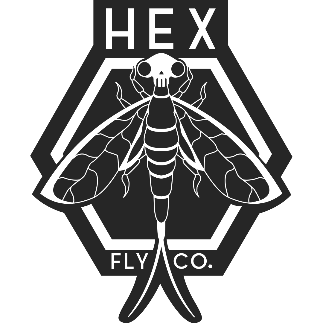 Black and white logo featuring a bee with a skull on its head, enclosed in a hexagon with the words 'HEX FLY CO.' surrounding it.