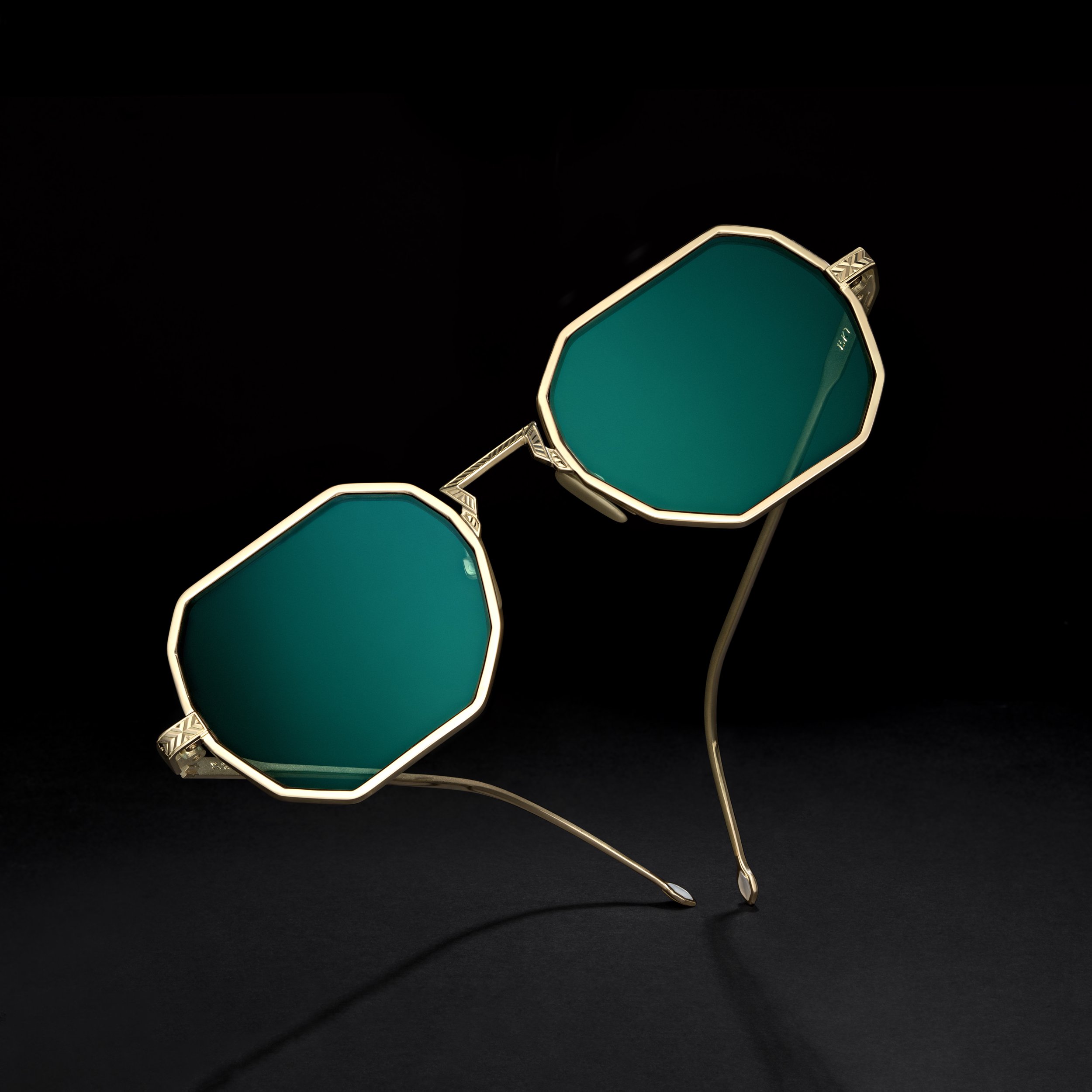 Gold hand fabricated sunglasses. 