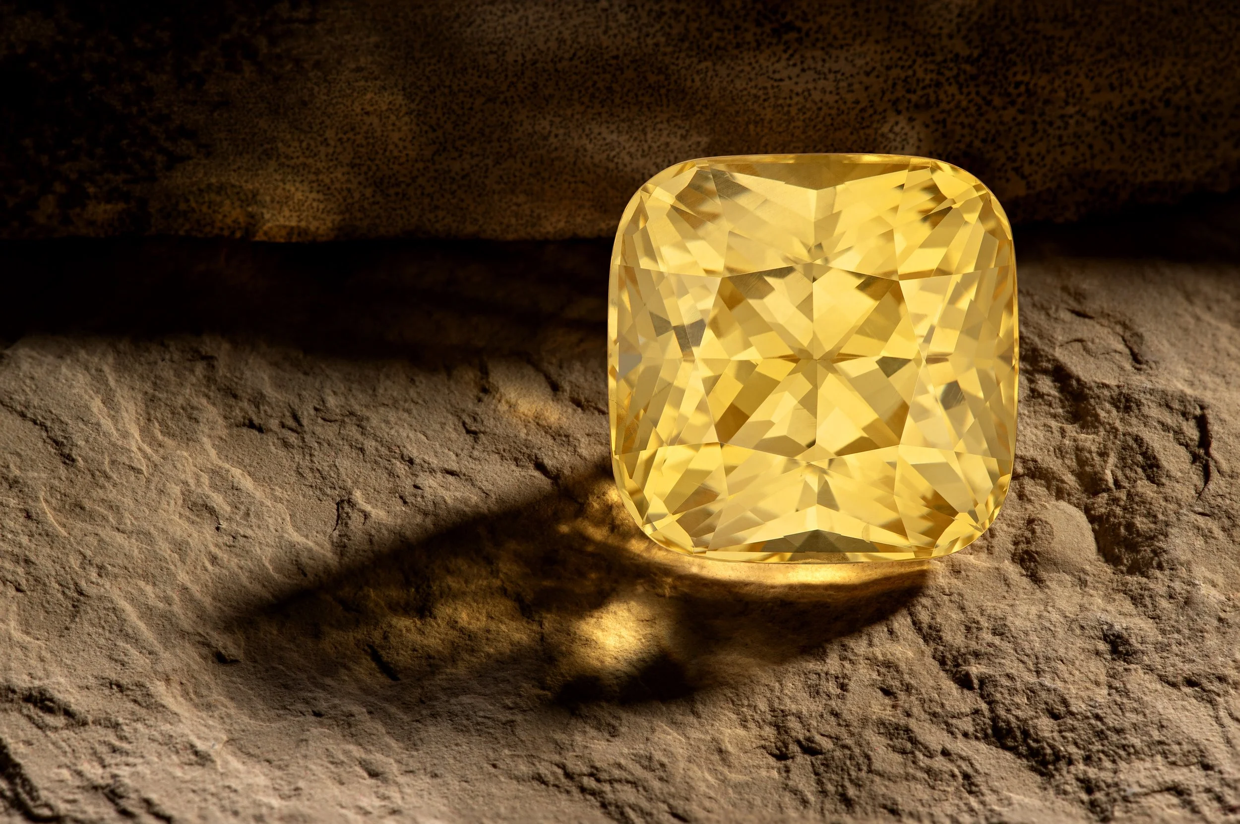 23.43ct_Yellow_Sapphire_Cushion on sandstone